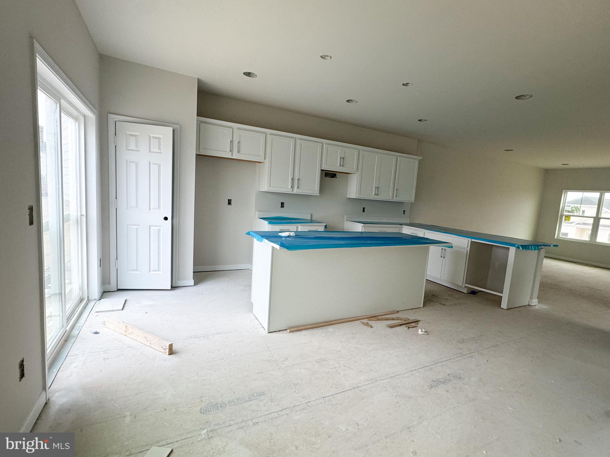 105 Gelding Way Stephenson, VA 22656 - Photo 5 of 16 a kitchen with a stove a refrigerator and white cabinets
