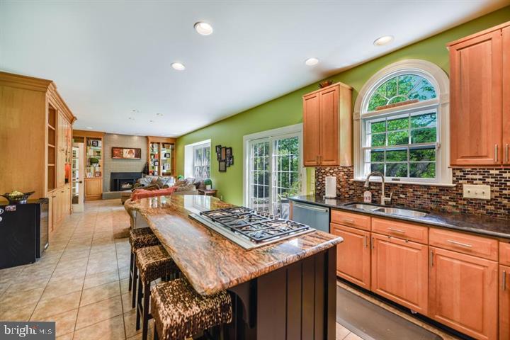 2162 Landis Valley Road Lancaster, PA 17601 - Photo 11 of 27 a large kitchen with kitchen island granite countertop a large window and stainless steel appliances