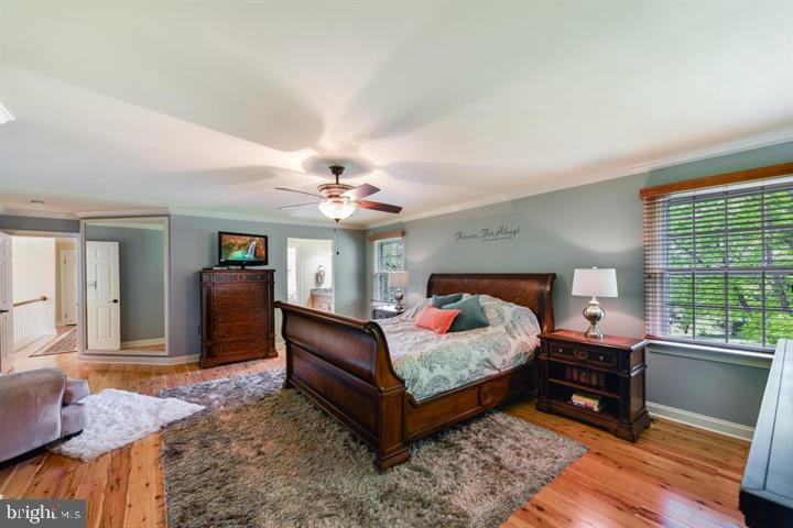 2162 Landis Valley Road Lancaster, PA 17601 - Photo 20 of 27 a bedroom with a bed and wooden floor