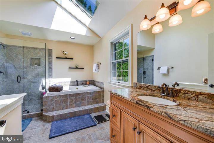 2162 Landis Valley Road Lancaster, PA 17601 - Photo 21 of 27 a spacious bathroom with a granite countertop double vanity sink a mirror and a bathtub