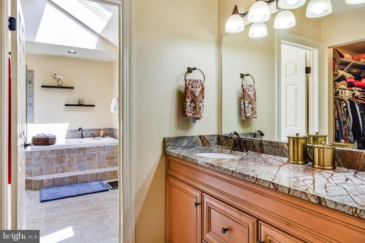2162 Landis Valley Road Lancaster, PA 17601 - Photo 22 of 27 a bathroom with a granite countertop sink and a mirror
