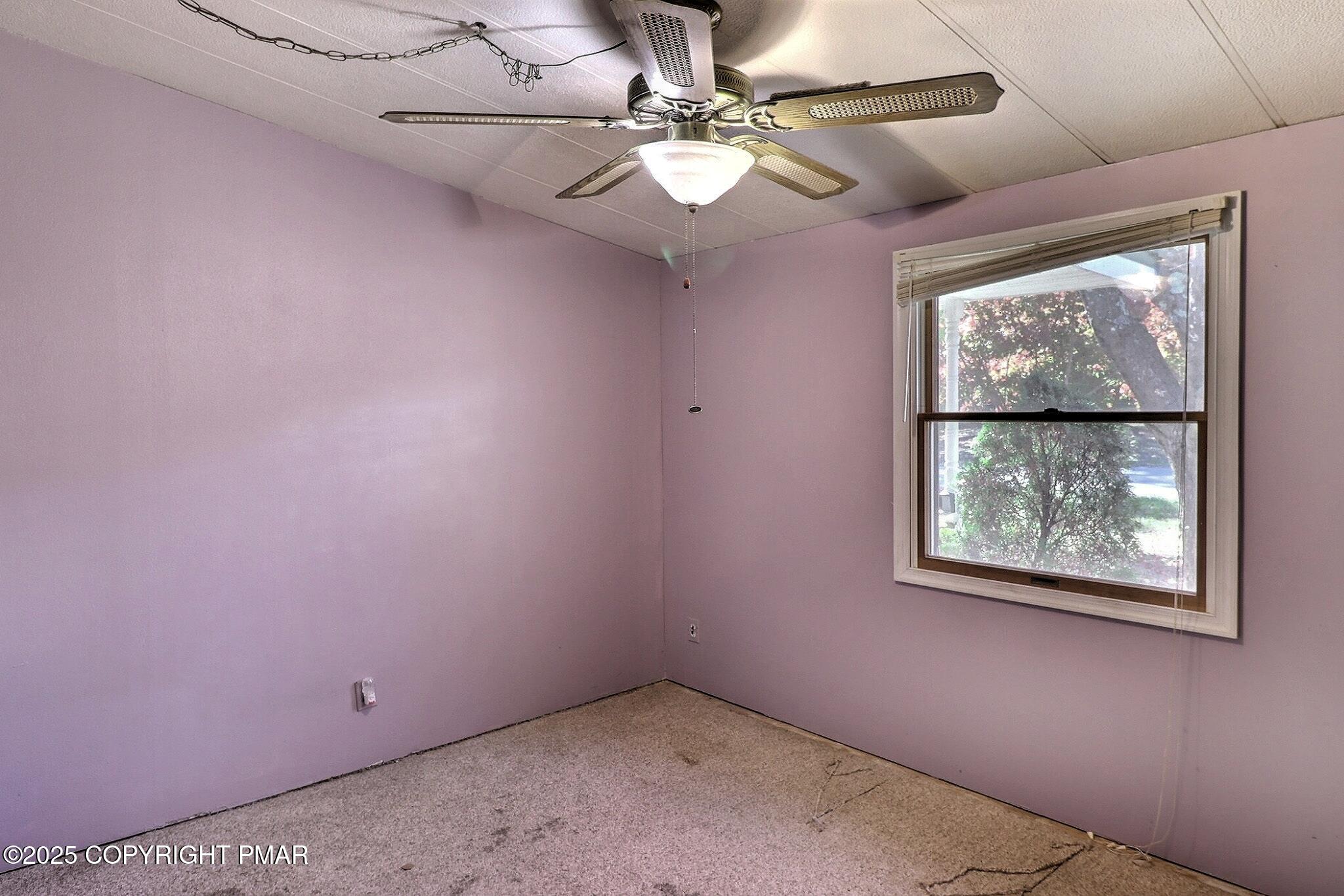120 Upper Green Hill Road Kunkletown, PA 18058 - Photo 15 of 19 an empty room with windows and fan