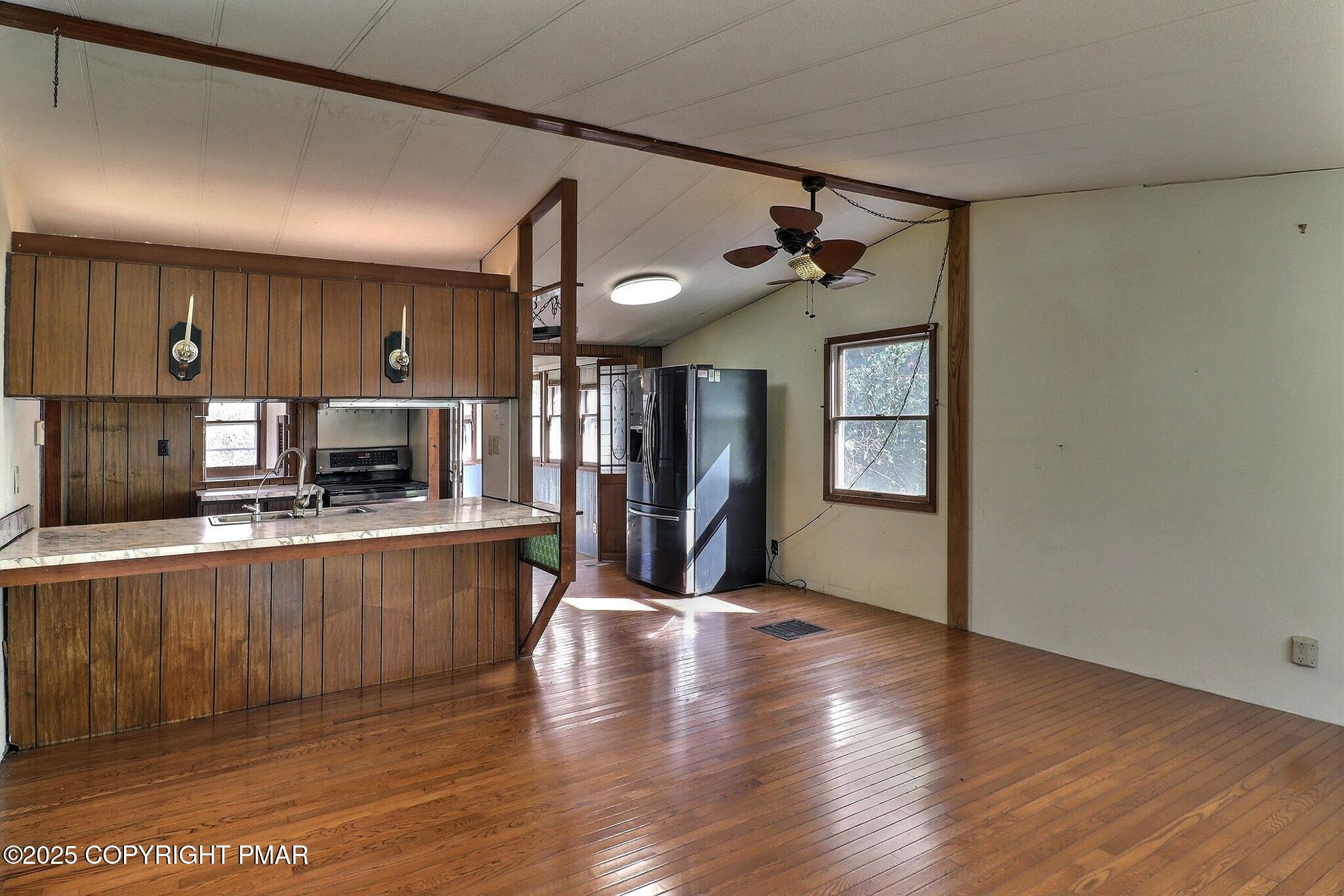 120 Upper Green Hill Road Kunkletown, PA 18058 - Photo 3 of 19 a large kitchen with a table and chairs in it