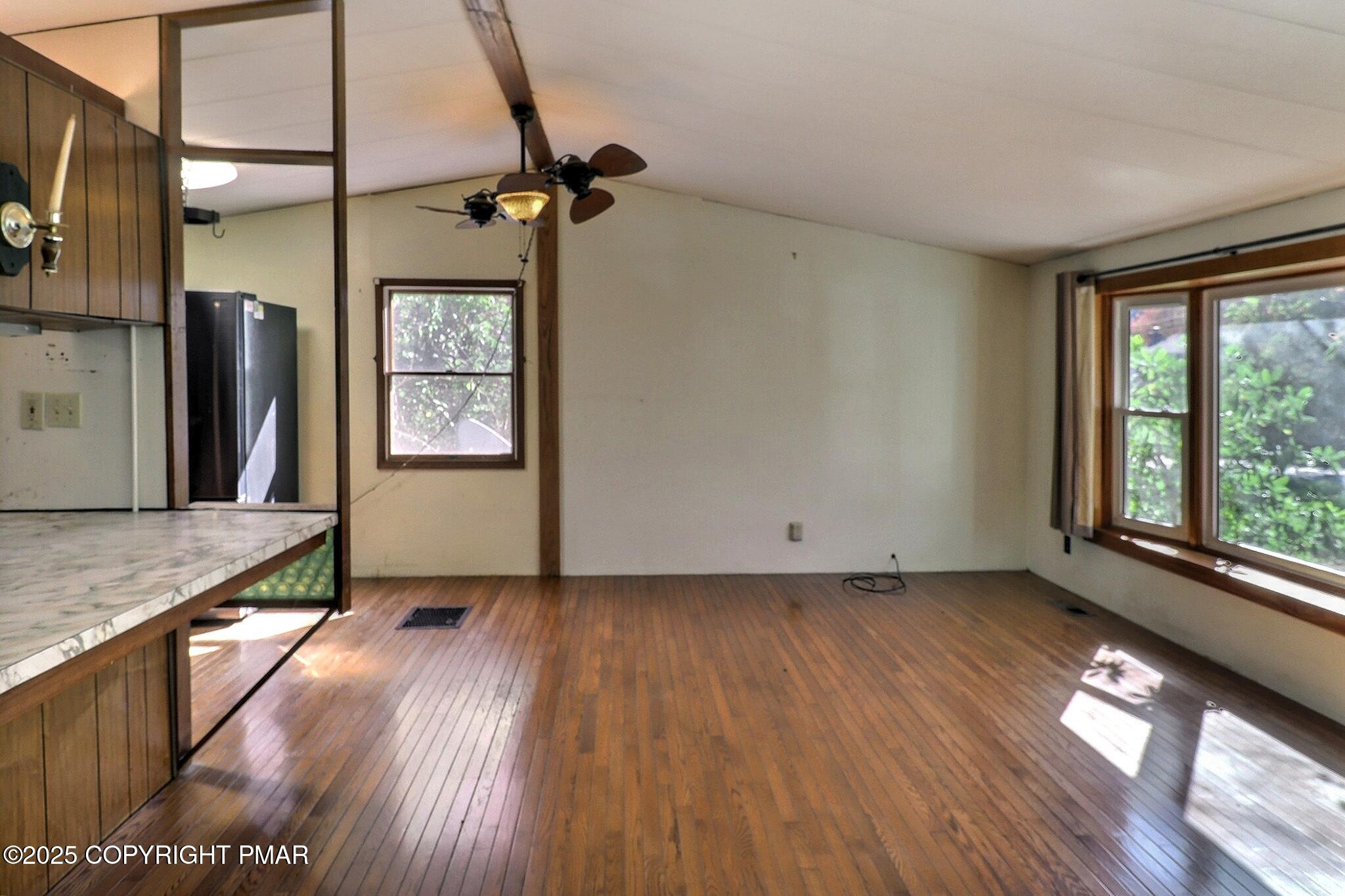 120 Upper Green Hill Road Kunkletown, PA 18058 - Photo 5 of 19 a view of hallway with window and wooden floor