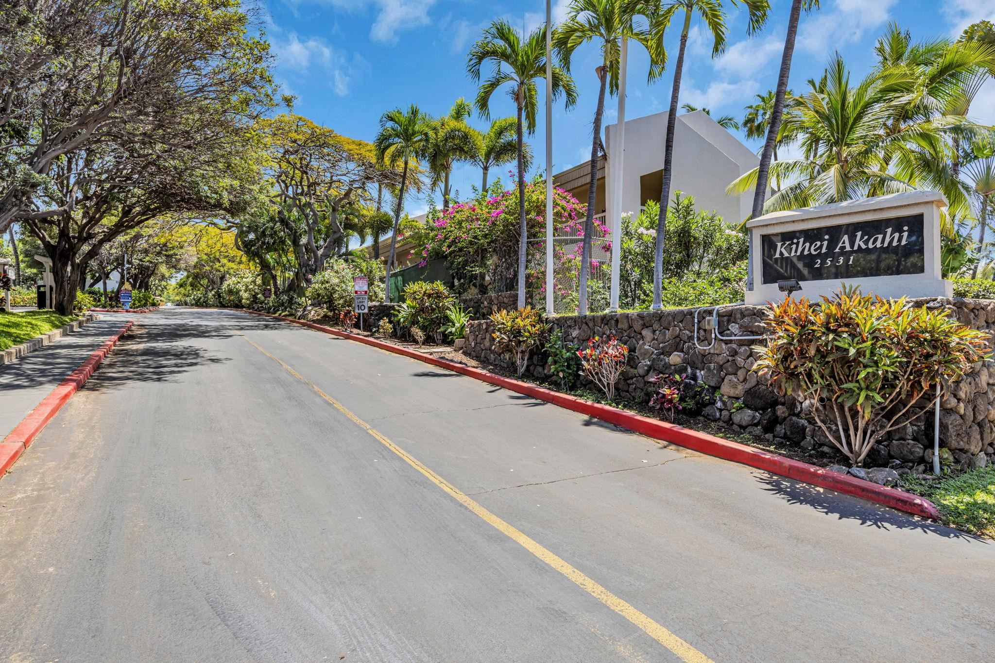 2531 South Kihei Road, Unit C620 Kihei, HI 96753 - Photo 13 of 38 a view of a street with potted plants and palm trees