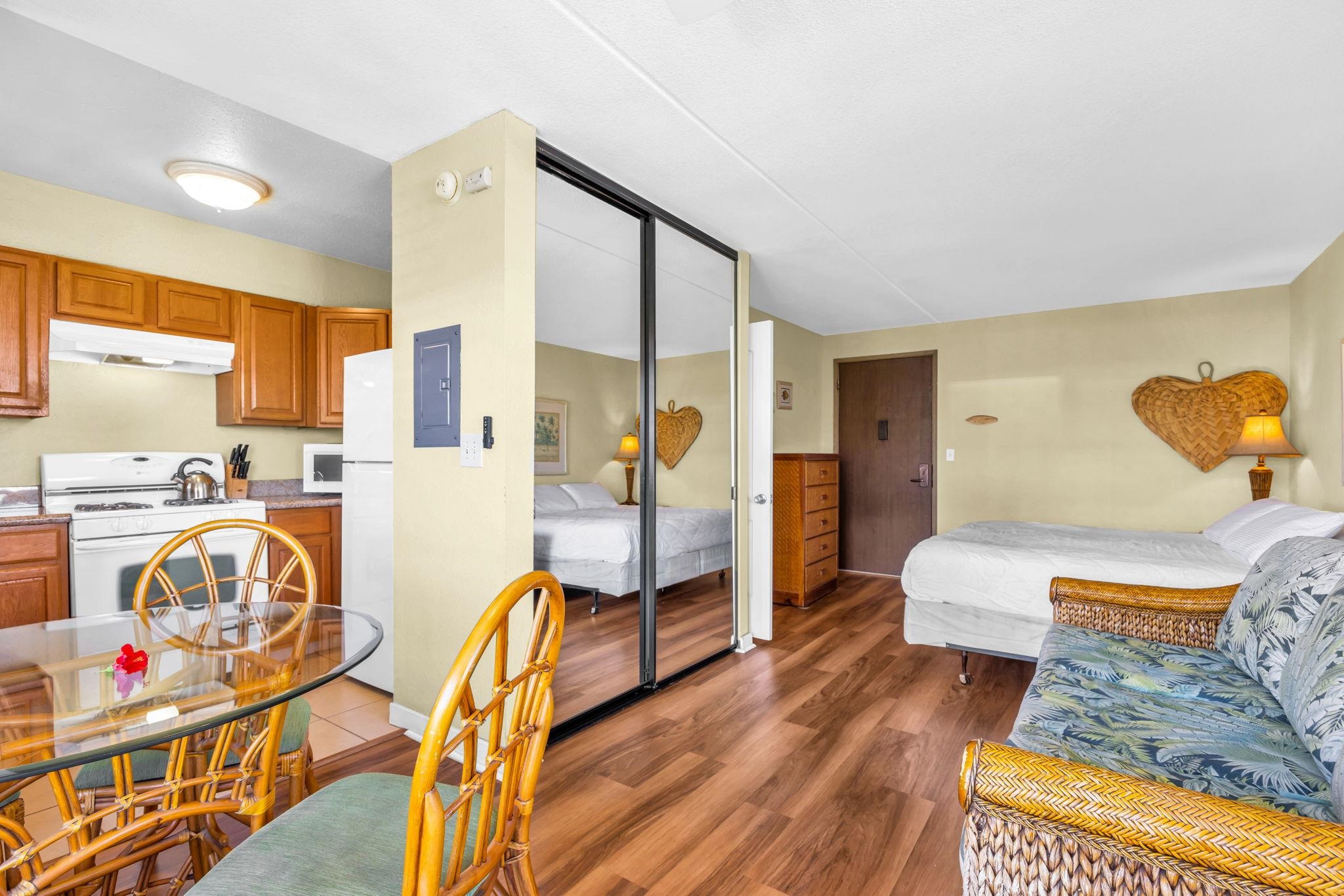 2531 South Kihei Road, Unit C620 Kihei, HI 96753 - Photo 20 of 38 a bedroom with furniture and a wooden floor