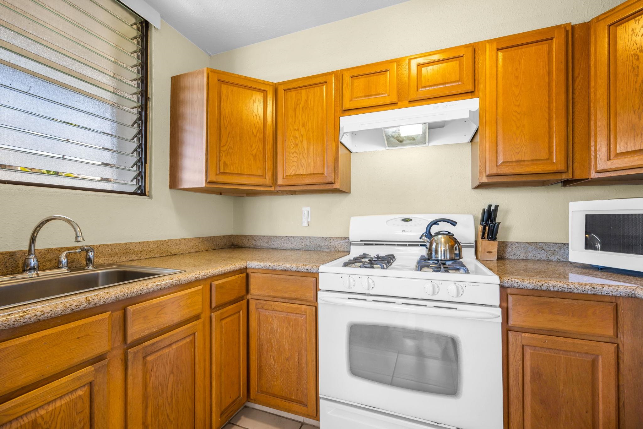 2531 South Kihei Road, Unit C620 Kihei, HI 96753 - Photo 22 of 38 a kitchen with stainless steel appliances granite countertop a sink stove and cabinets