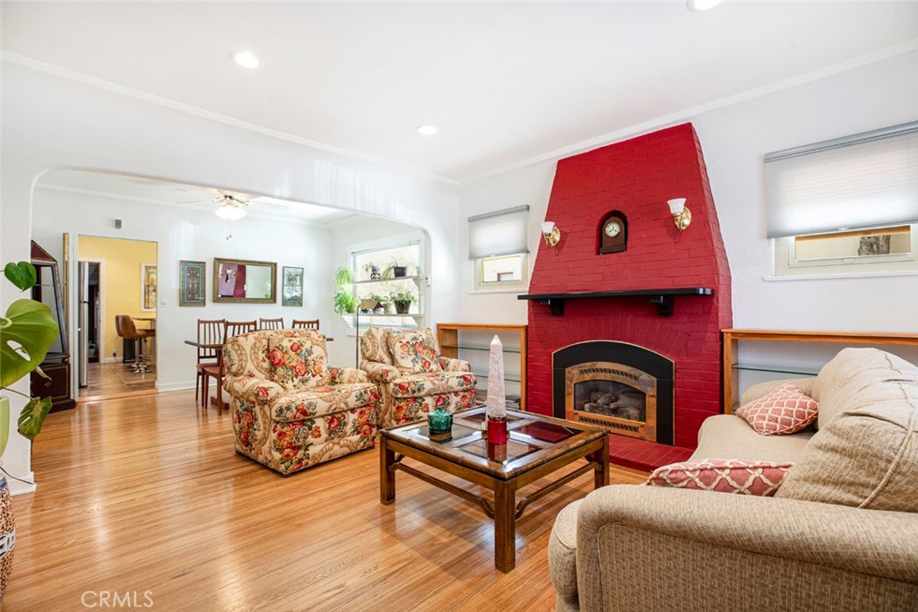 1130 Park Avenue Glendale, CA 91205 - Photo 12 of 75 a living room with furniture a fireplace and wooden floor