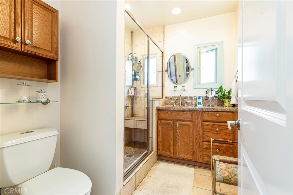 1130 Park Avenue Glendale, CA 91205 - Photo 19 of 75 a bathroom with a granite countertop sink toilet and shower