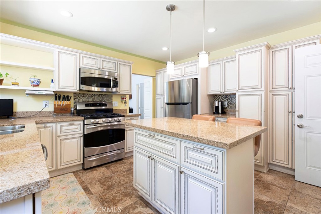 1130 Park Avenue Glendale, CA 91205 - Photo 32 of 75 a kitchen with kitchen island granite countertop appliances cabinets and a sink