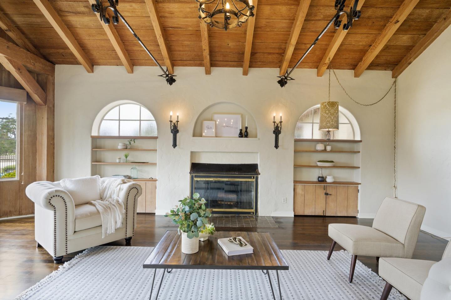 3080 Bird Rock Road Pebble Beach, CA 93953 - Photo 12 of 46 a living room with furniture and a fireplace