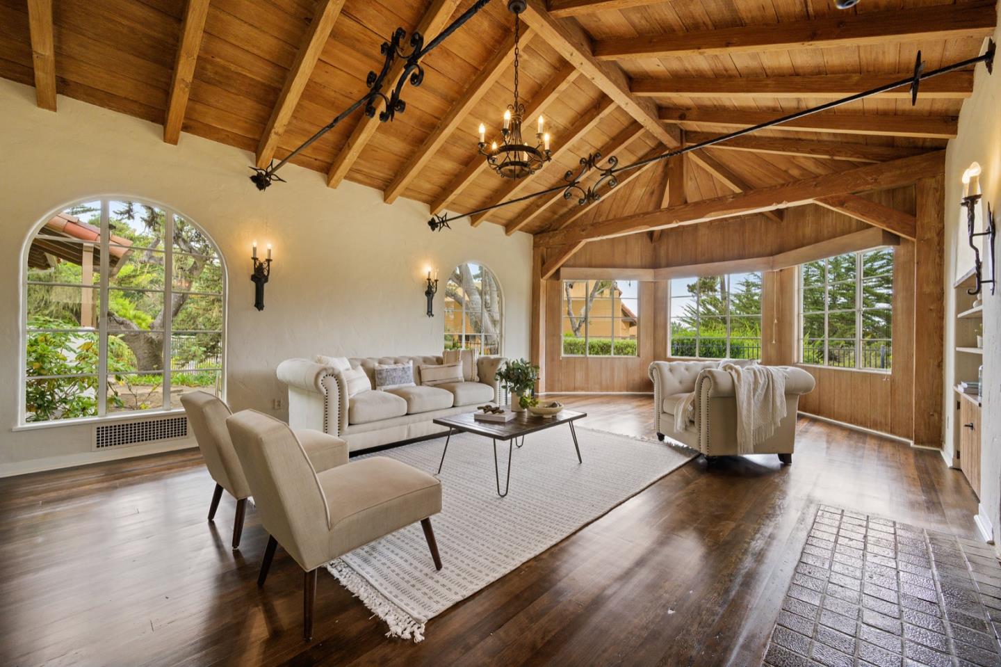 3080 Bird Rock Road Pebble Beach, CA 93953 - Photo 13 of 46 a living room with furniture and a chandelier
