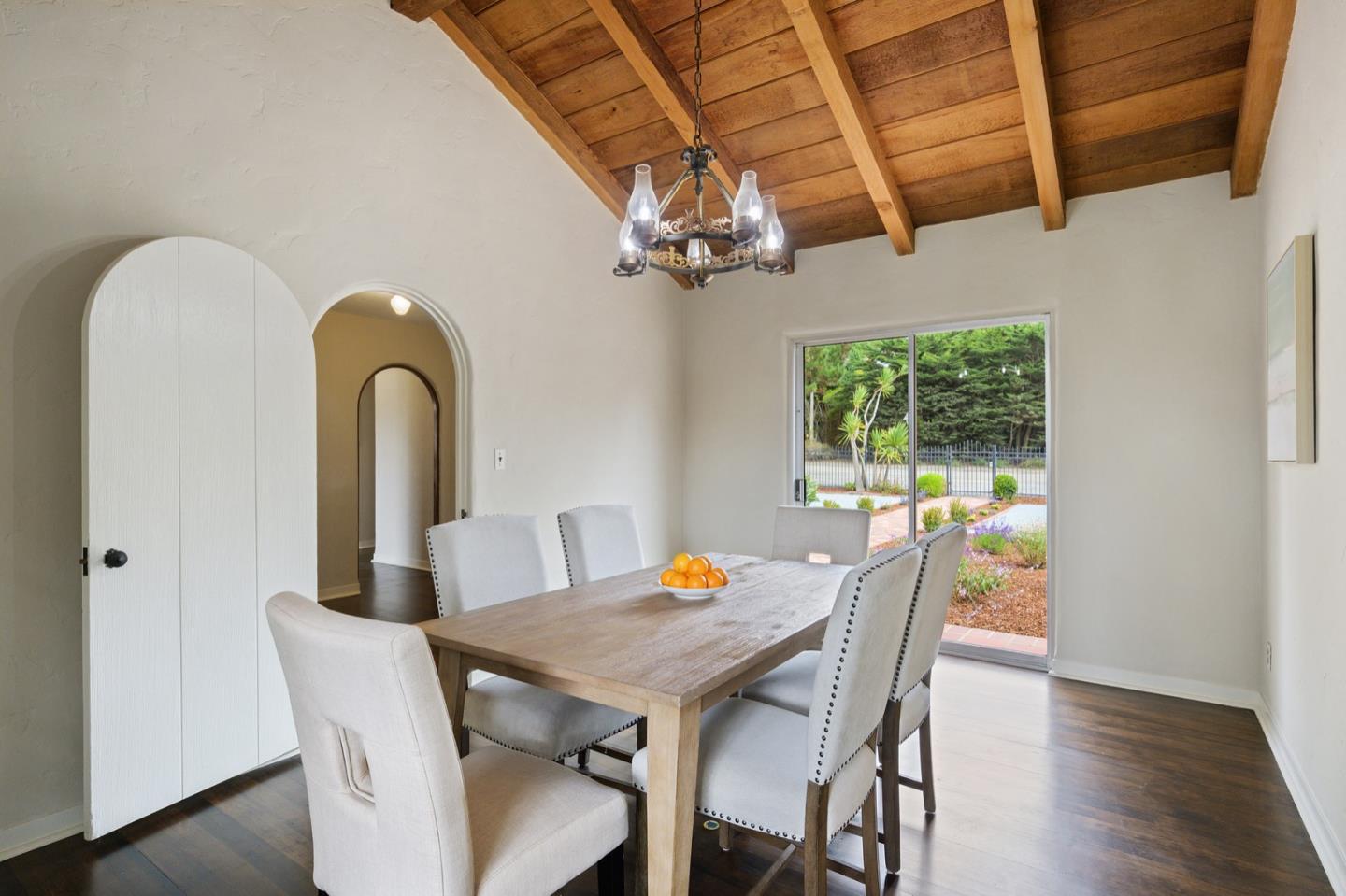 3080 Bird Rock Road Pebble Beach, CA 93953 - Photo 18 of 46 a view of a dining room with furniture window and wooden floor