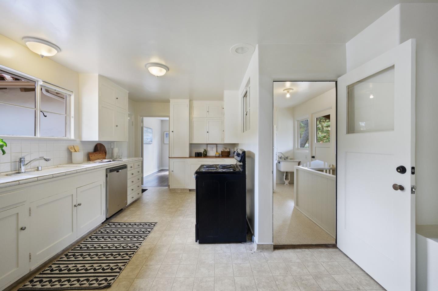 3080 Bird Rock Road Pebble Beach, CA 93953 - Photo 19 of 46 a kitchen with a refrigerator and a stove
