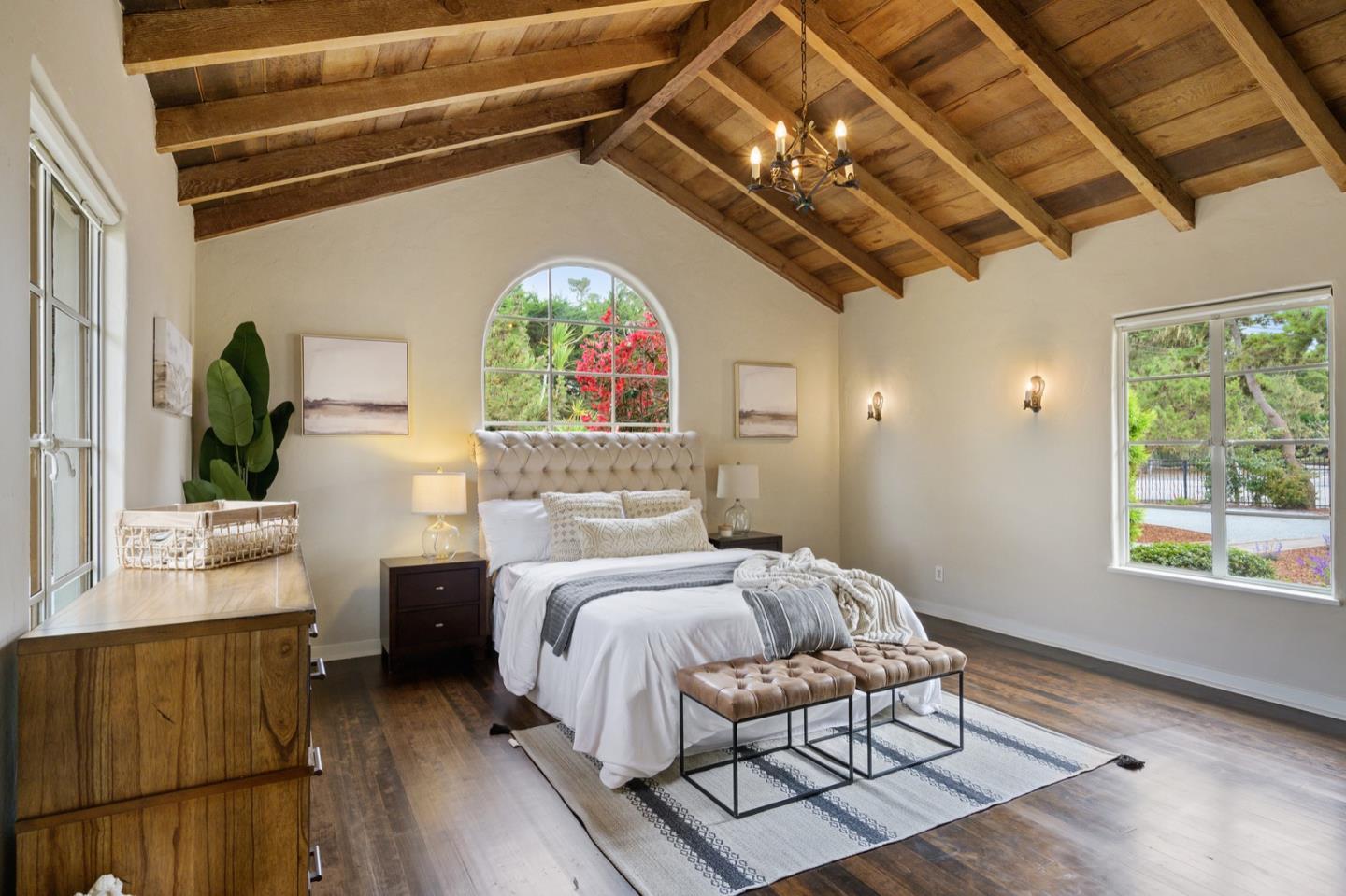 3080 Bird Rock Road Pebble Beach, CA 93953 - Photo 22 of 46 a bedroom with furniture and a large window