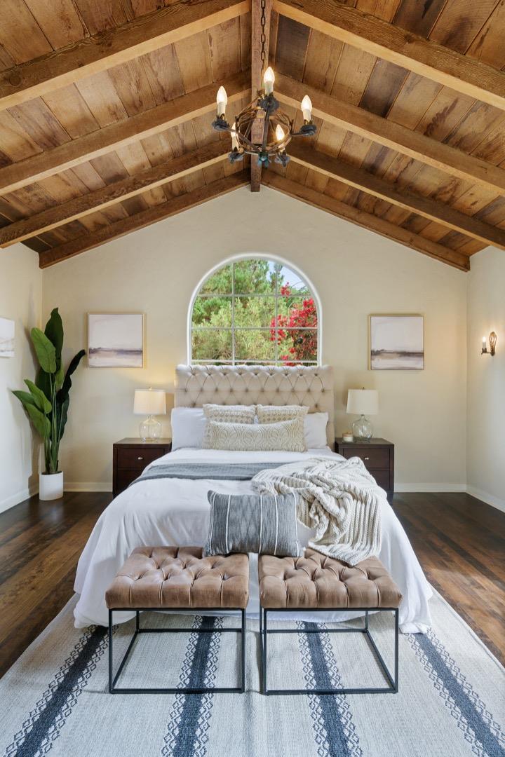 3080 Bird Rock Road Pebble Beach, CA 93953 - Photo 23 of 46 a bedroom with furniture and a chandelier