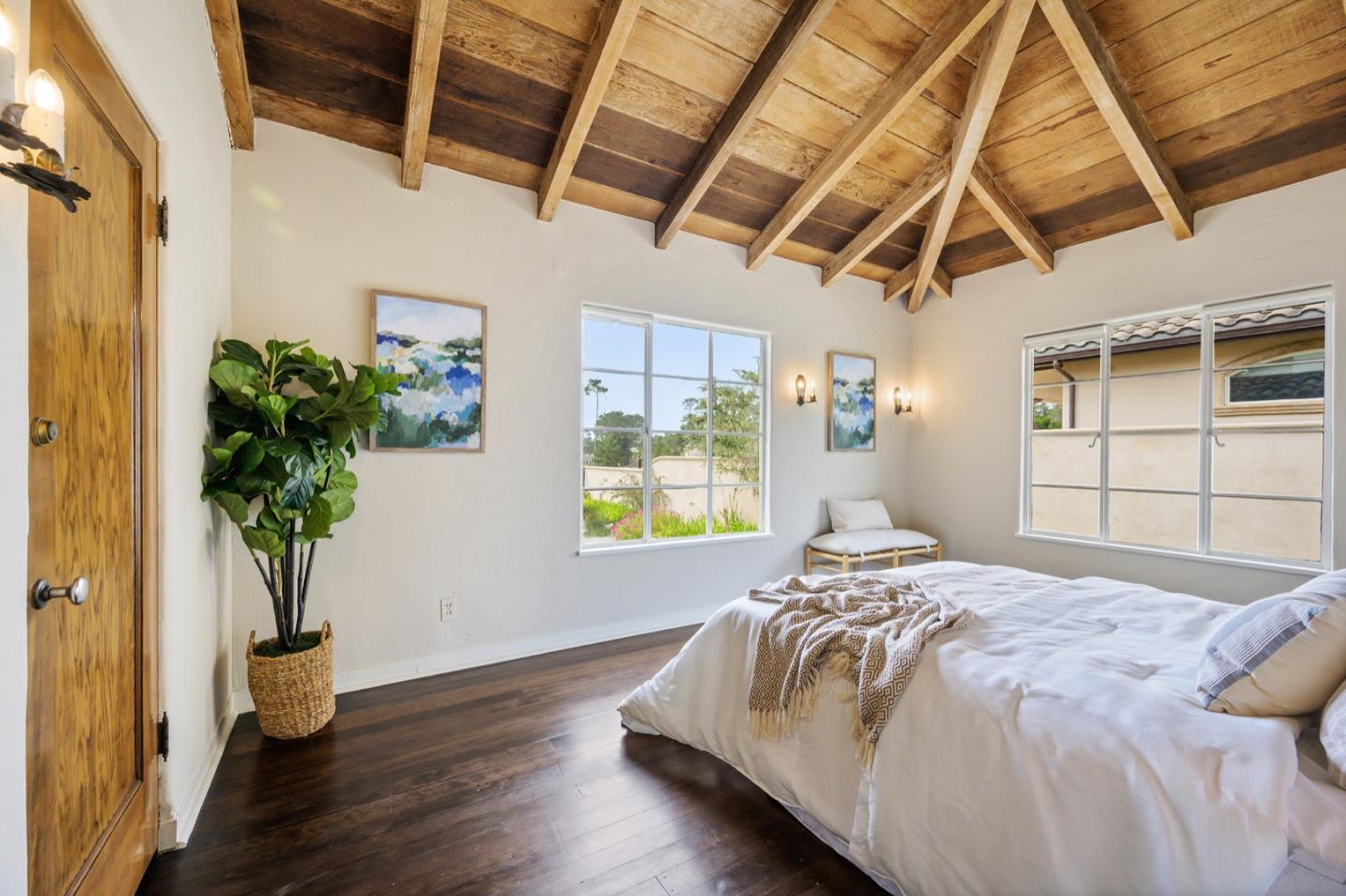 3080 Bird Rock Road Pebble Beach, CA 93953 - Photo 26 of 46 a bedroom with a bed and a potted plant