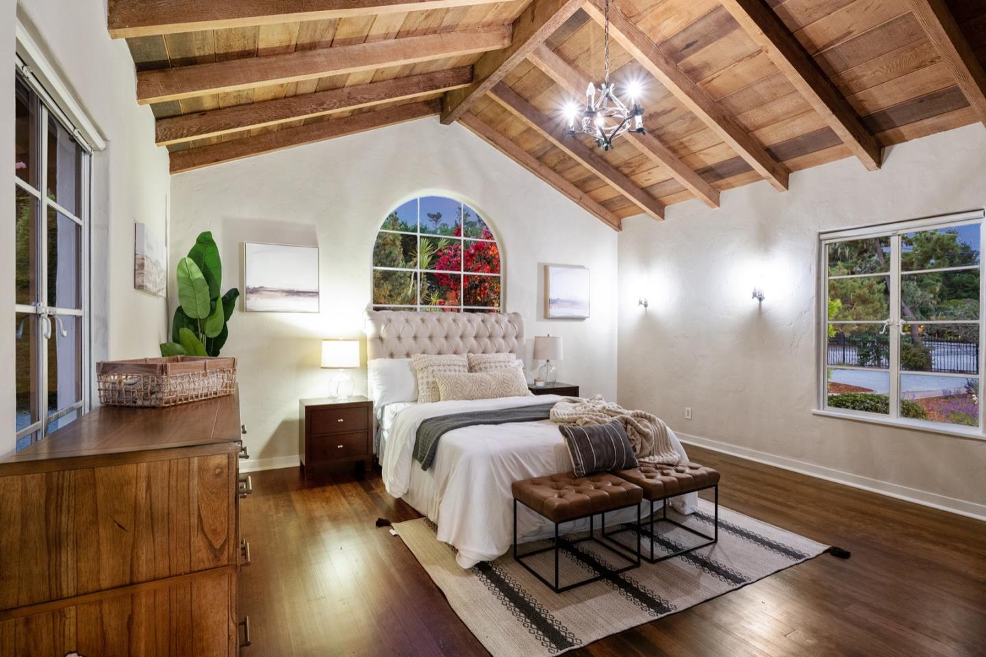 3080 Bird Rock Road Pebble Beach, CA 93953 - Photo 37 of 46 a living room with furniture a chandelier and a window
