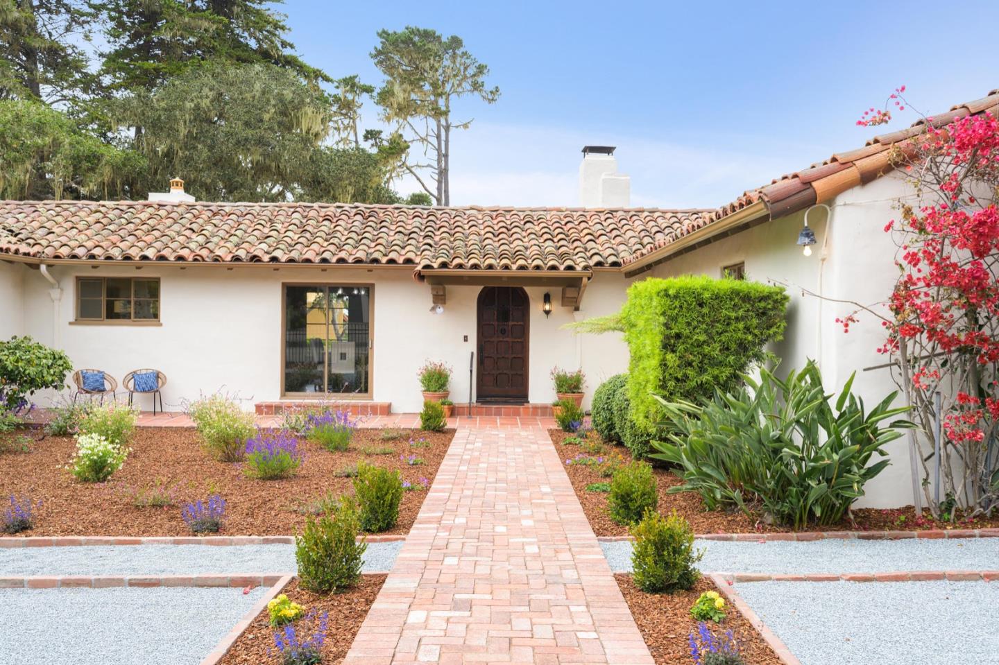 3080 Bird Rock Road Pebble Beach, CA 93953 - Photo 4 of 46 a front view of a house with garden