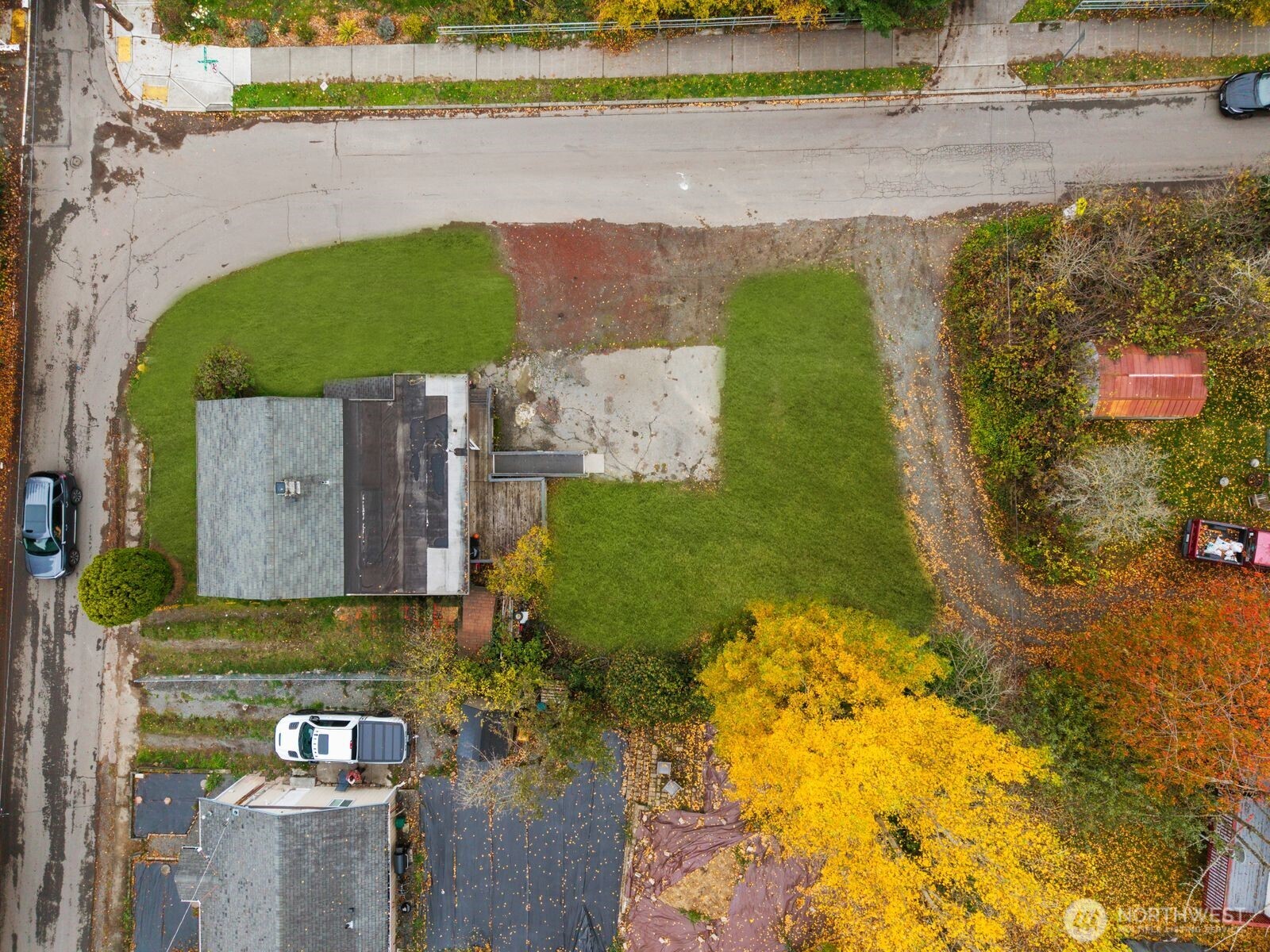 an aerial view of a house with a yard