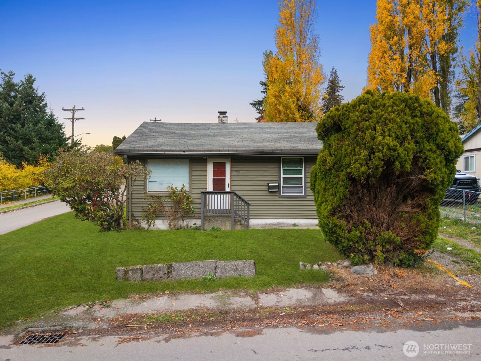 702 South Director Street Seattle, WA 98108 - Photo 5 of 14 a view of a house with a yard