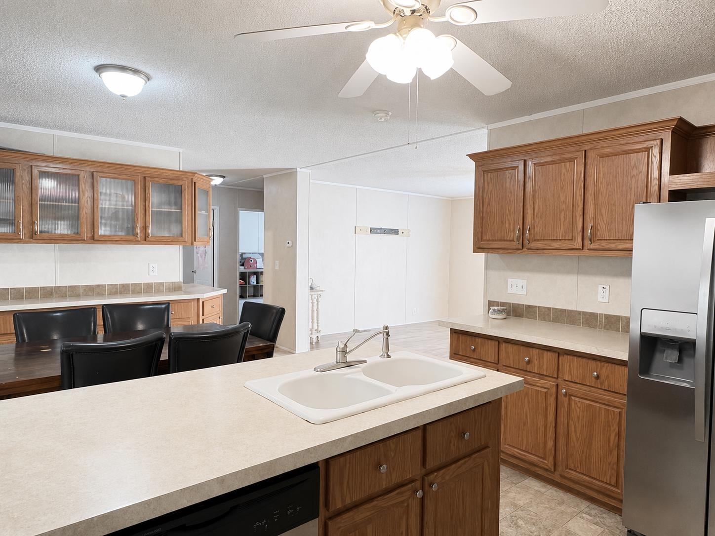 476 Pickens Store Road Mason, TN 38049 - Photo 9 of 18 a kitchen with a sink and a refrigerator