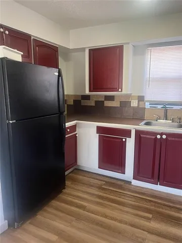 a bathroom with a toilet a sink and bathtub