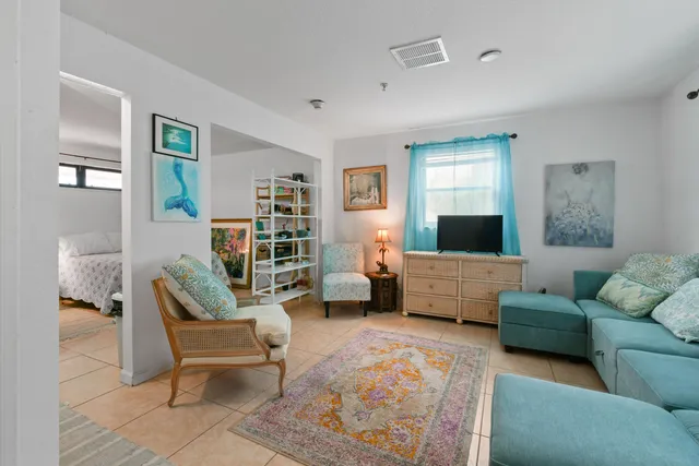 a view of a house with backyard and a garden