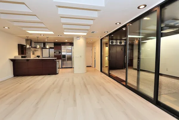 a bathroom with a glass shower door and a glass door shower