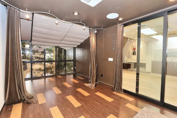 a view of a storage and utility room with washer and dryer