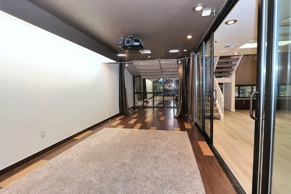 a view of a backyard with plants and outdoor seating