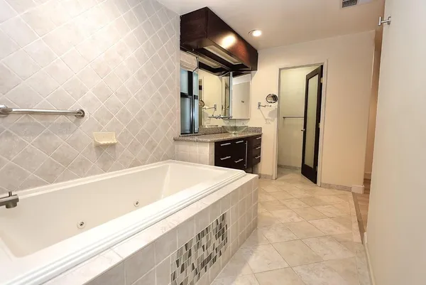 a view of empty room with wooden ceiling