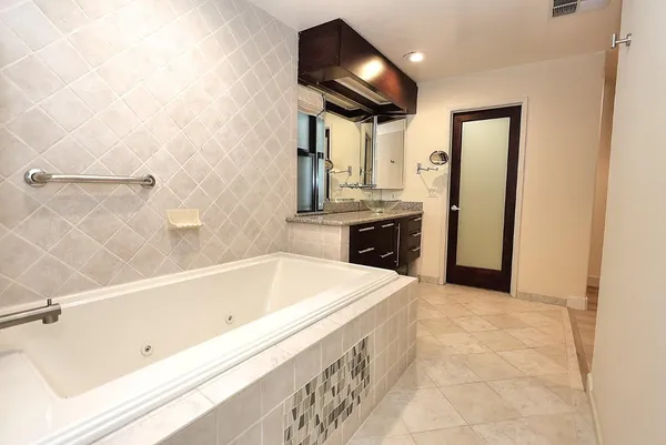 a wooden bench sitting in middle of a yard