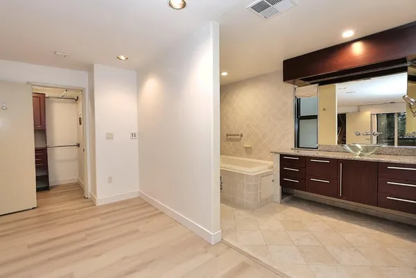 an aerial view of a house with a yard and lake view