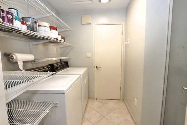 an aerial view of a house with swimming pool and outdoor space