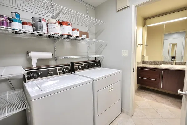 a living room with furniture and a mirror