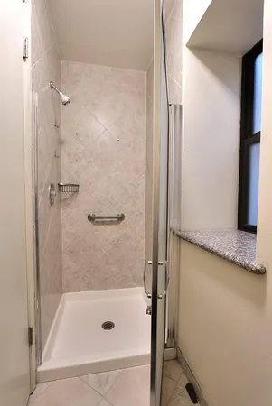 a row of palm trees in front of a house