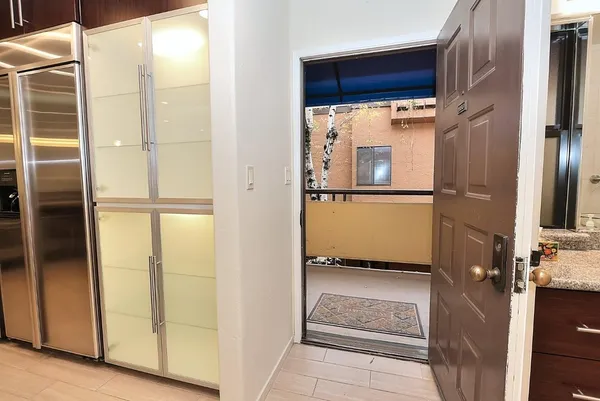 a view of a kitchen with furniture and a kitchen