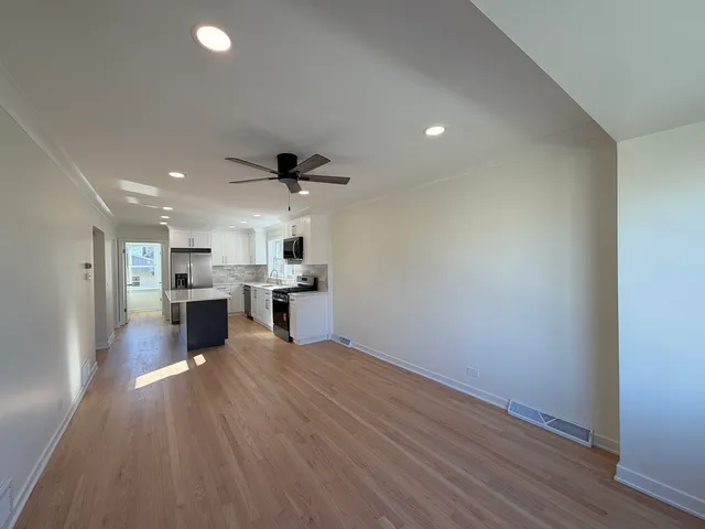 a view of kitchen with wooden floor