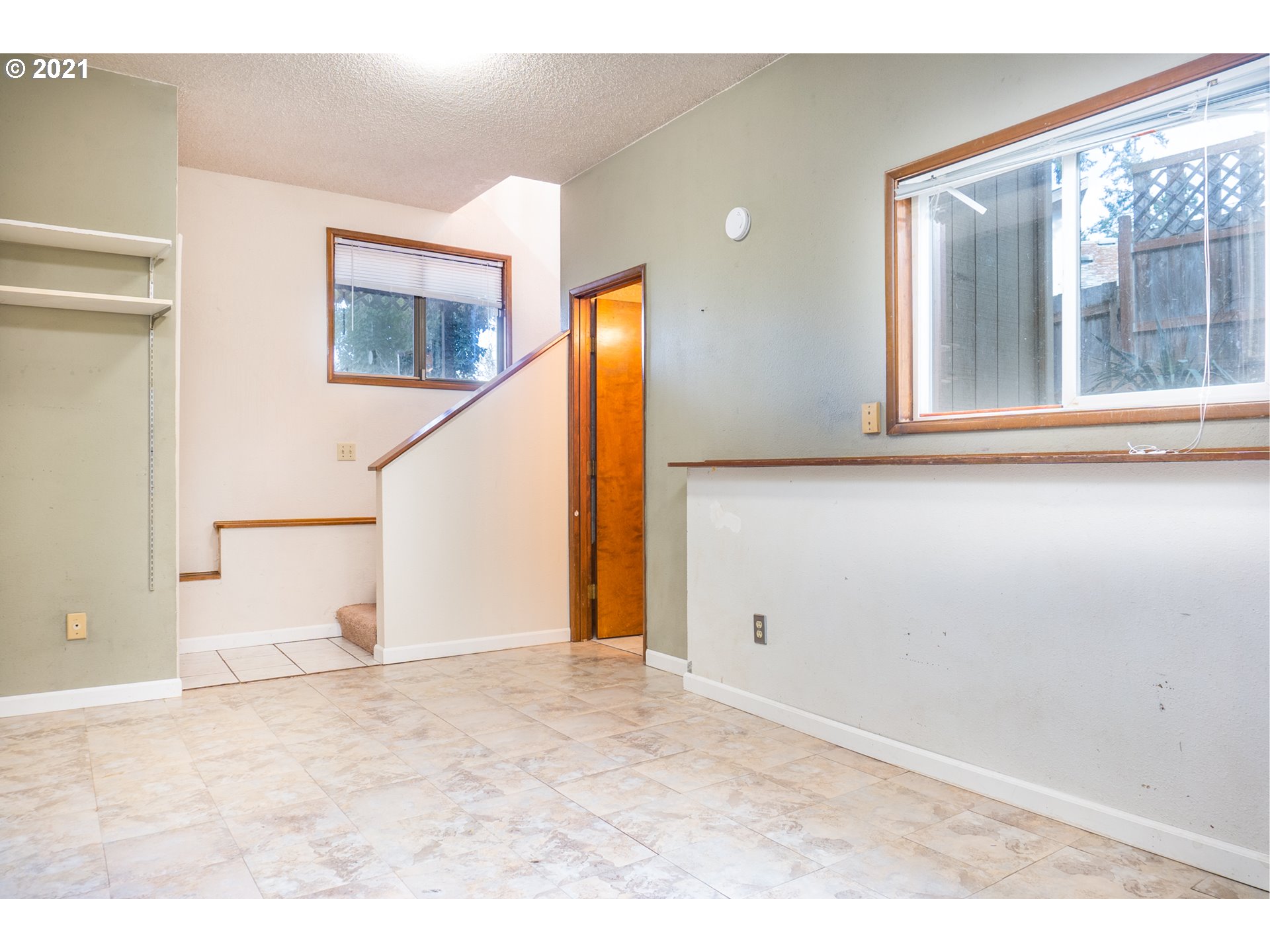 501 Cascade Drive Springfield, OR 97478 - Photo 22 of 31 a view of empty room with wooden floor and windows