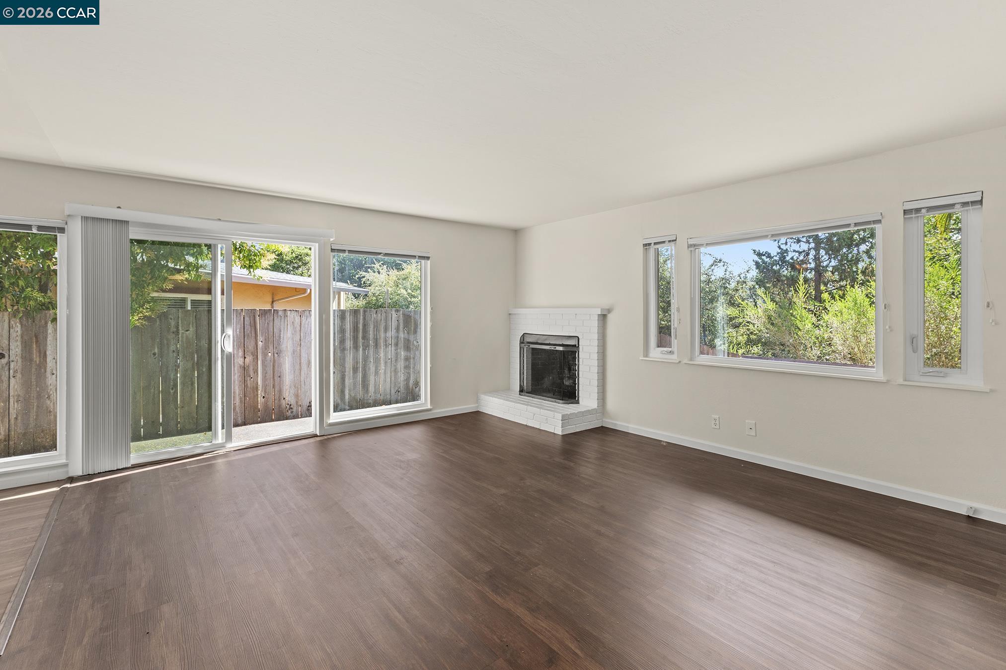 29 Leafwood Circle San Rafael, CA 94901 - Photo 13 of 34 a view of an empty room with wooden floor and a window