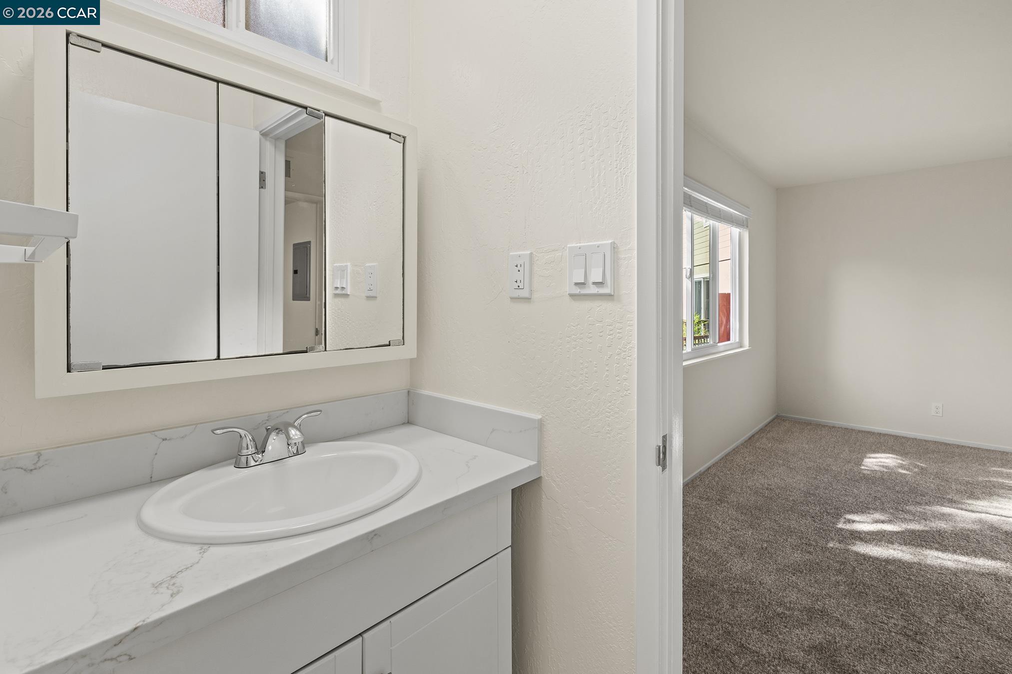 29 Leafwood Circle San Rafael, CA 94901 - Photo 22 of 34 a bathroom with a sink and a mirror