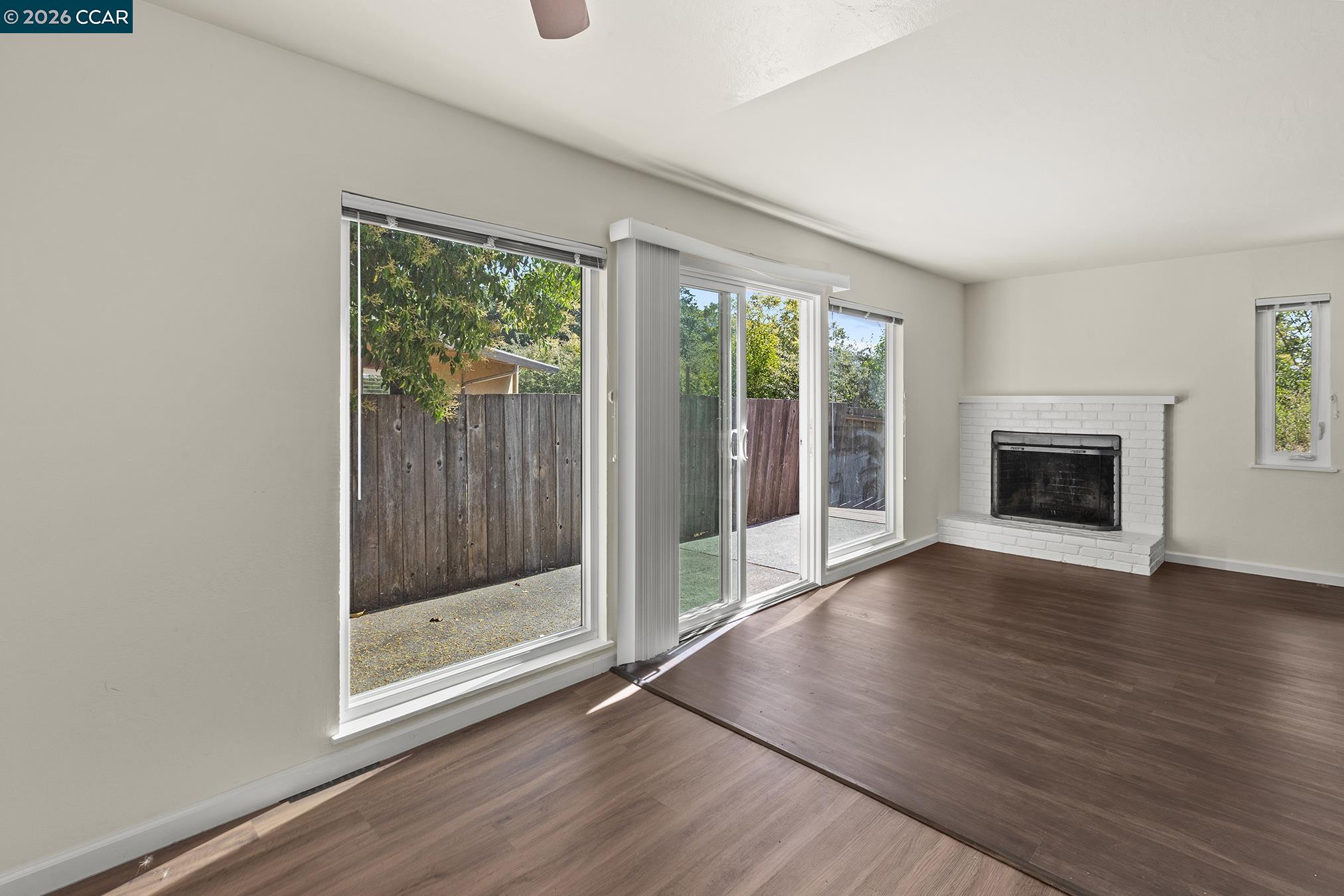 29 Leafwood Circle San Rafael, CA 94901 - Photo 24 of 34 a view of an empty room with wooden floor and a window