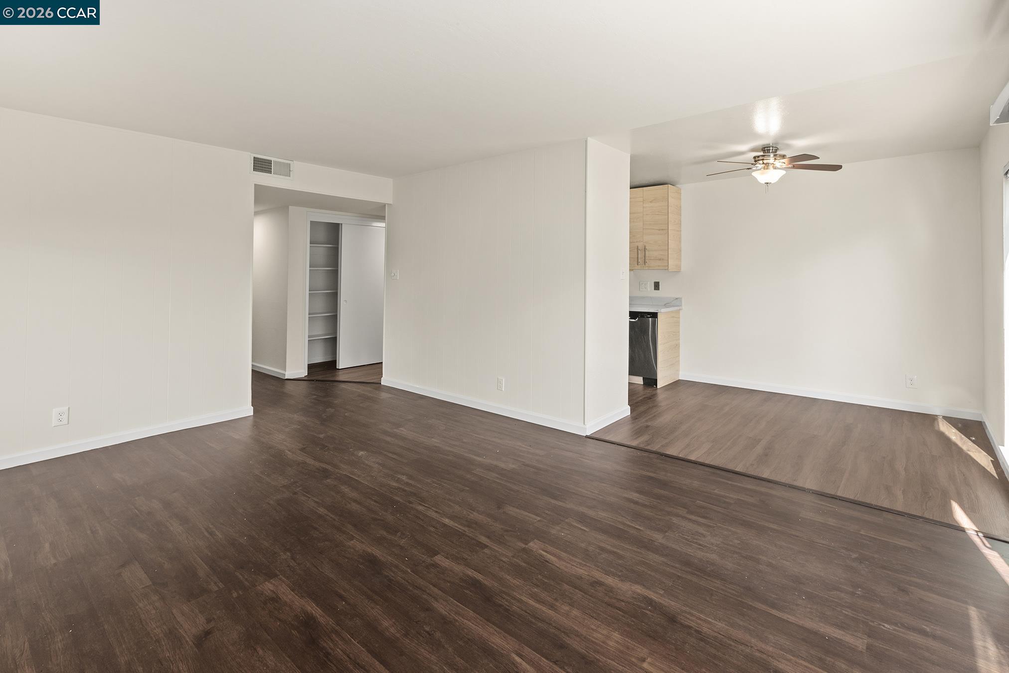 29 Leafwood Circle San Rafael, CA 94901 - Photo 27 of 34 an empty room with wooden floor ceiling fan and window