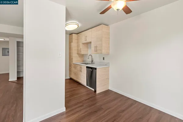 a kitchen with a sink and a refrigerator