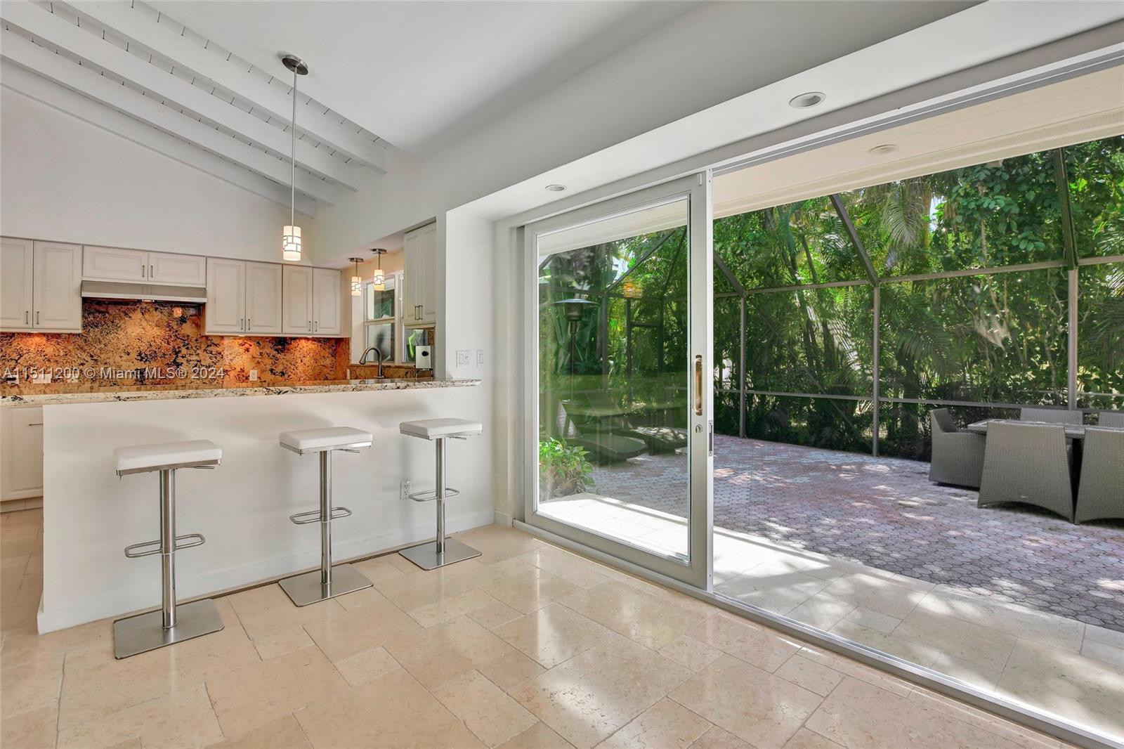 a kitchen with sink cabinets and outdoor view