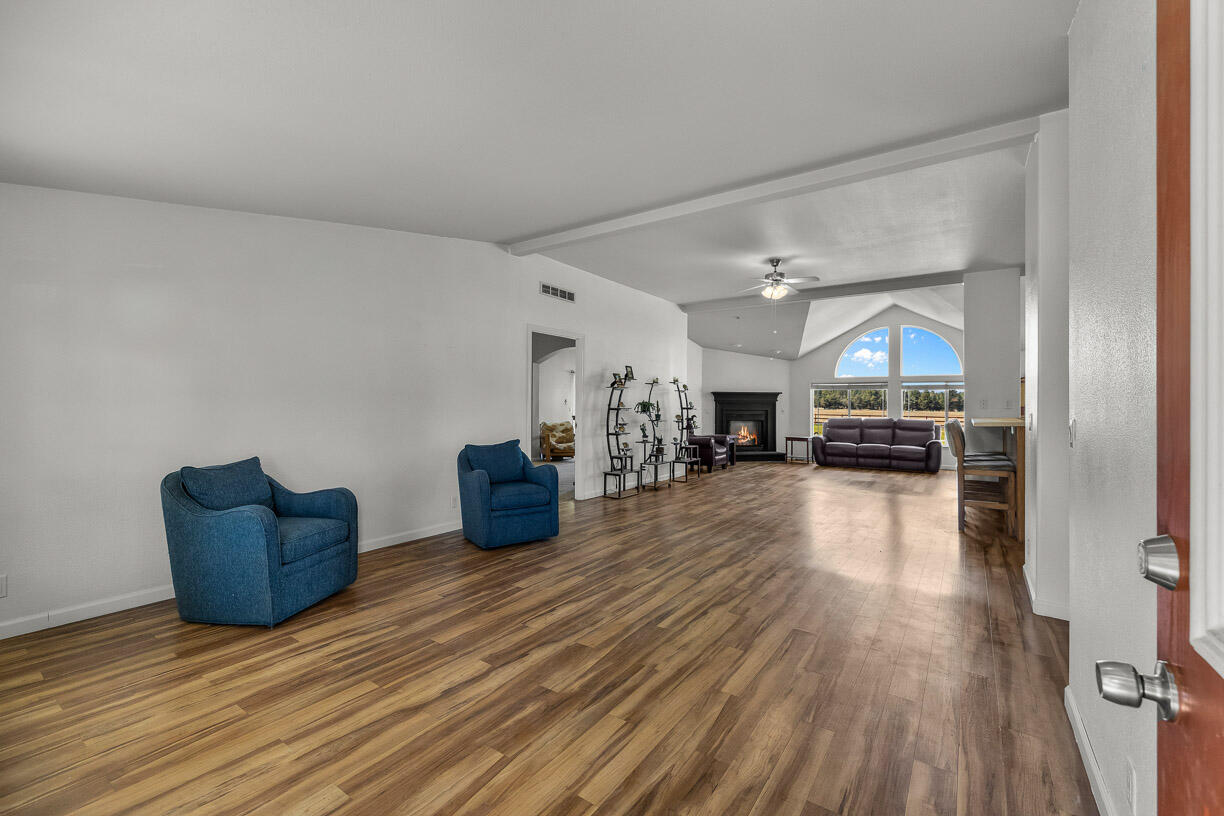 67500 Harrington Loop Road Bend, OR 97703 - Photo 8 of 72 a living room with furniture and a wooden floor