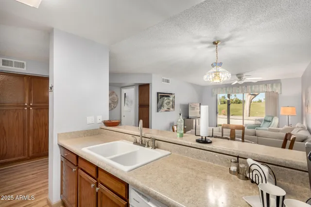 a spacious bathroom with a granite countertop sink and a large mirror
