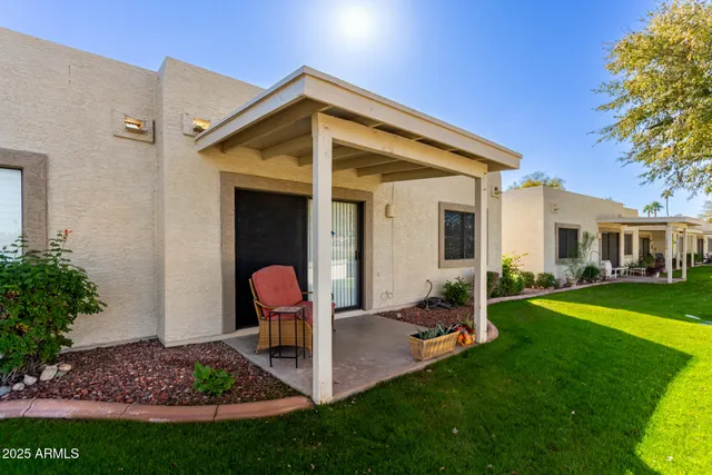 a front view of a house with garden and porch