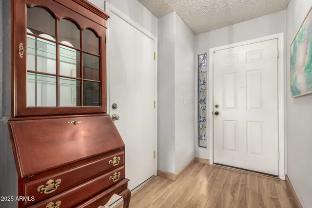 a view of room with window and wooden floor